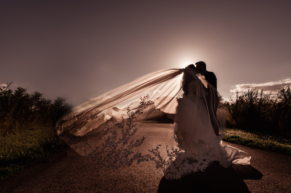 atmospheric bride and groom cotswolds barn wedding