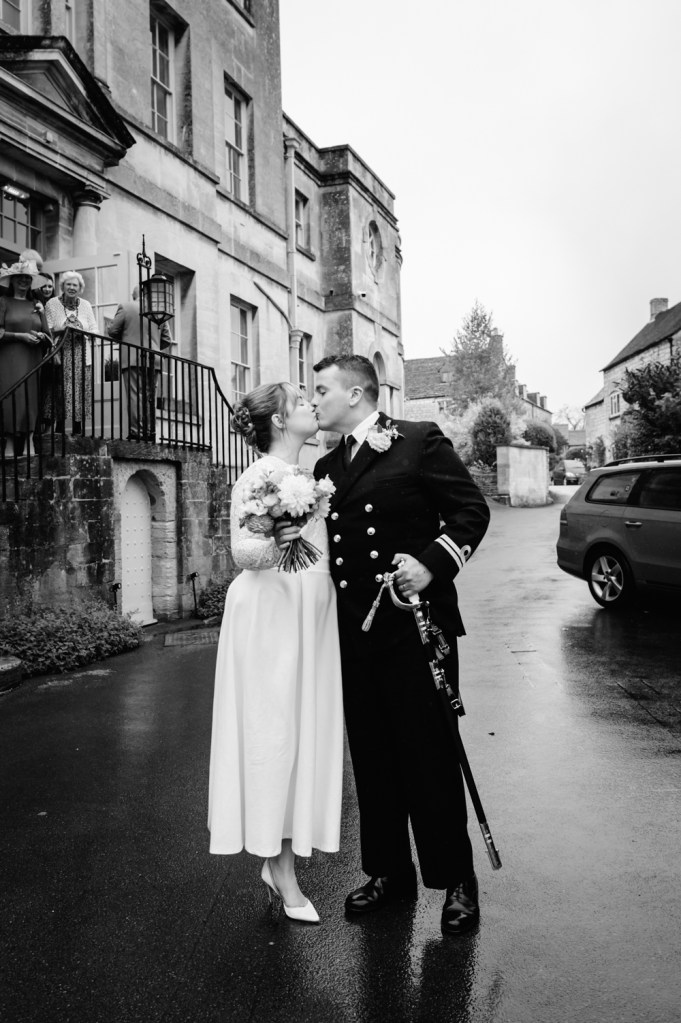 bride and groom kissing the painswisk hotel