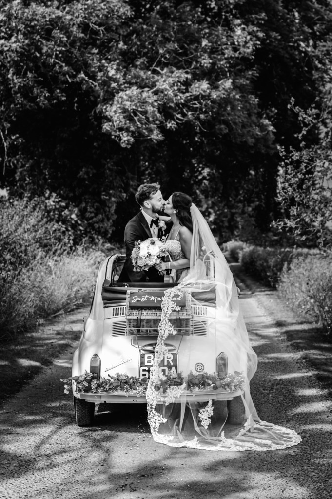 open top wedding car country lane