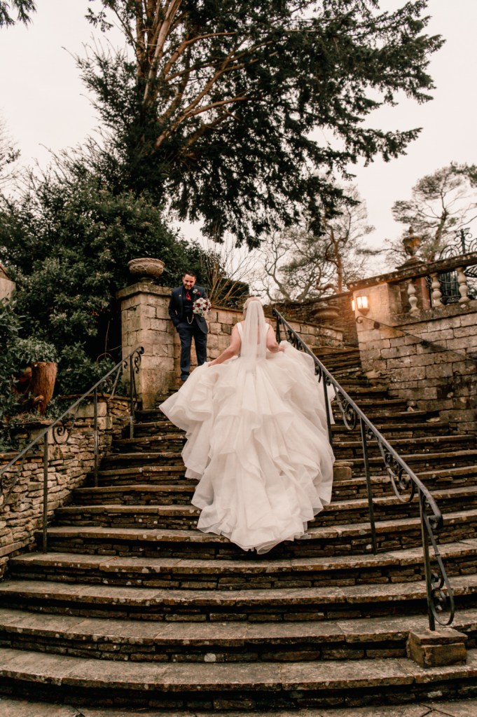 bride walking up stairs dramatic photo