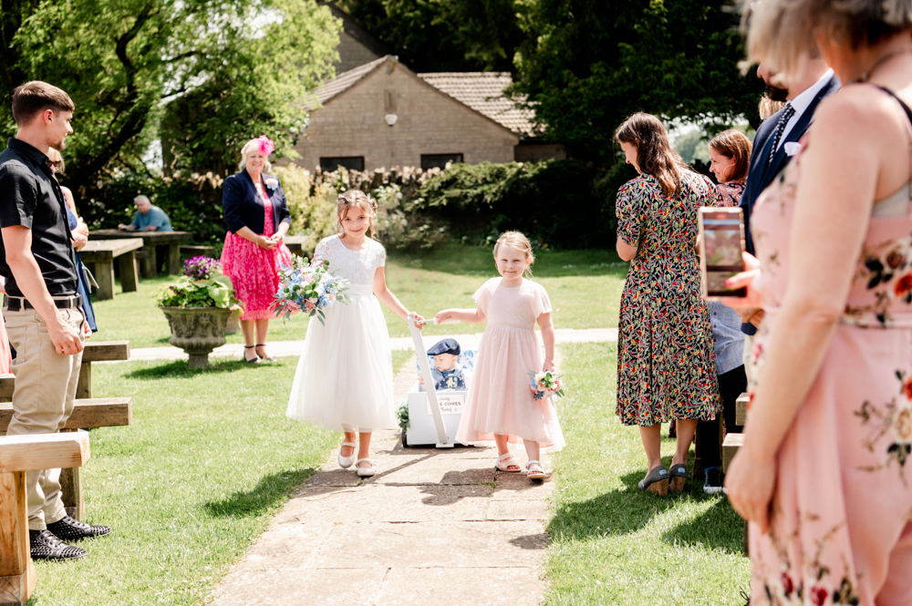 bridesmaids pulling cart troller page boy
