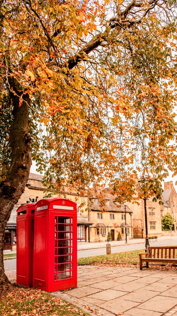 red telephone box cotswolds autumn