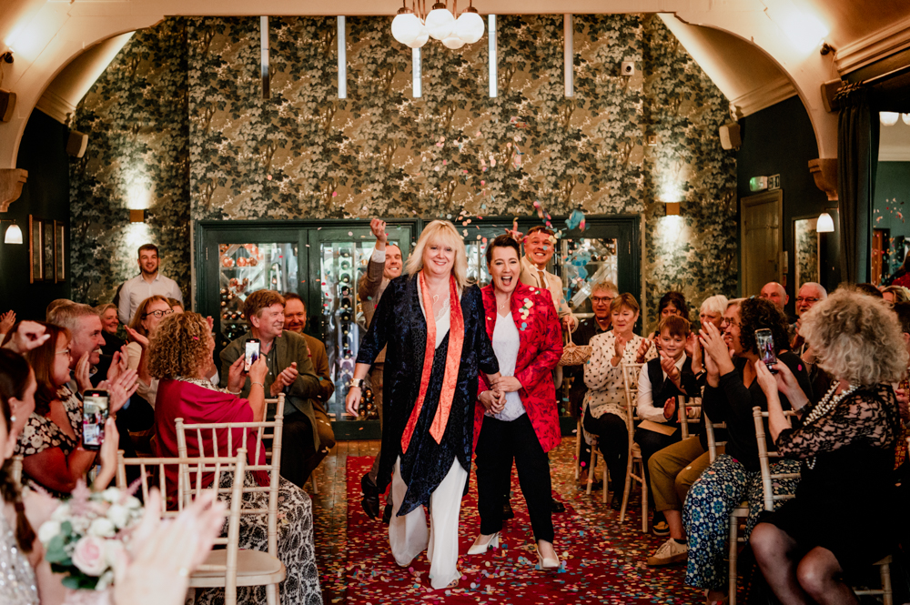 same sex wedding two brides colourful