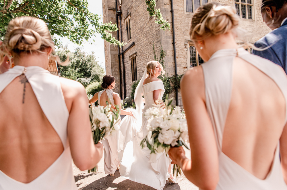 bride walking with bridesmaids