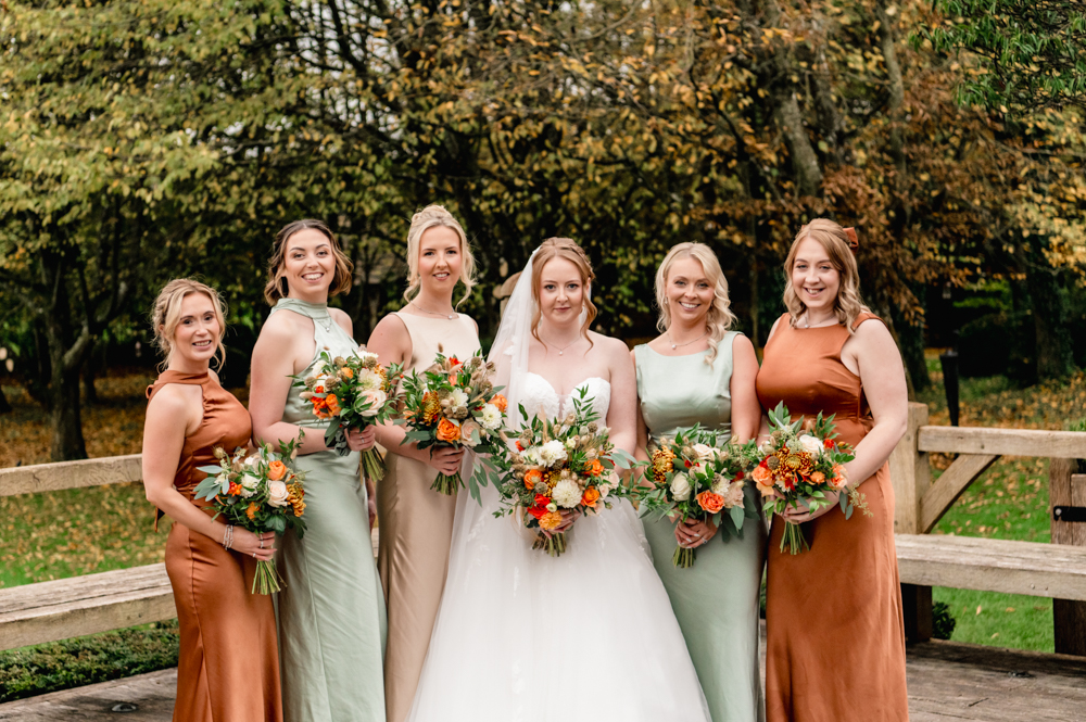 bride and  bridesmaids gold and rust wedding