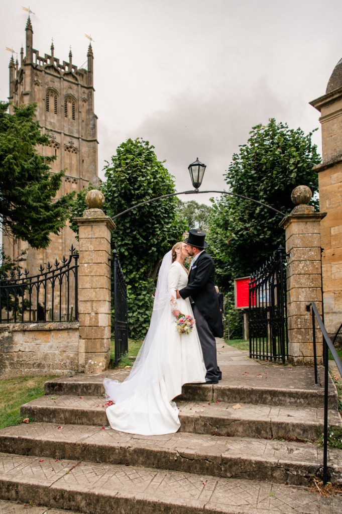 elegant church wedding bride and groom kissing