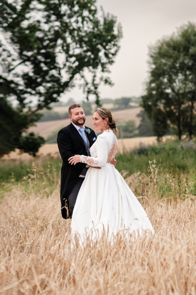 bride and groom under tree countryside wedding