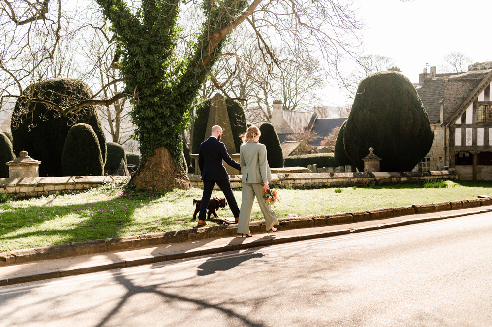 couple walking cotswold village engagement