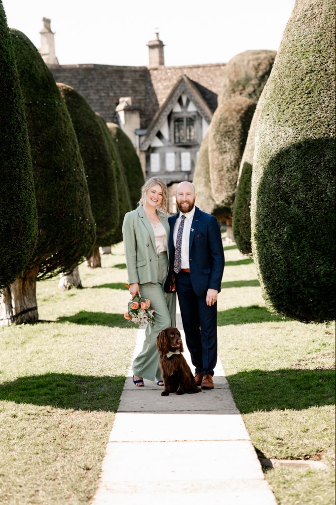 bride and groom with a dog
