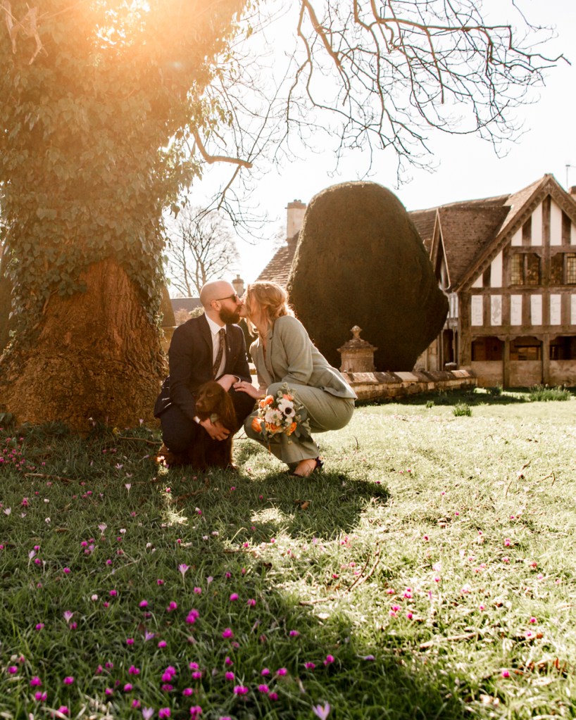 bride and groom kissing at sunset