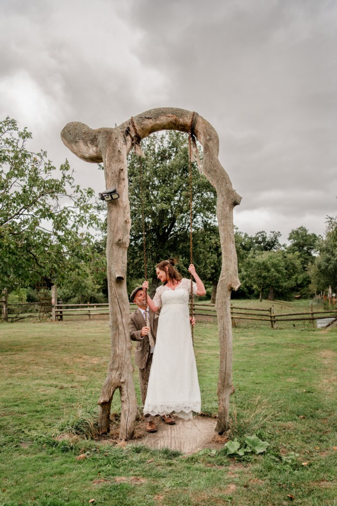 bride and groom on swing