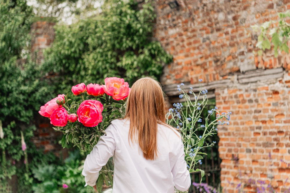 woman carrying flowers