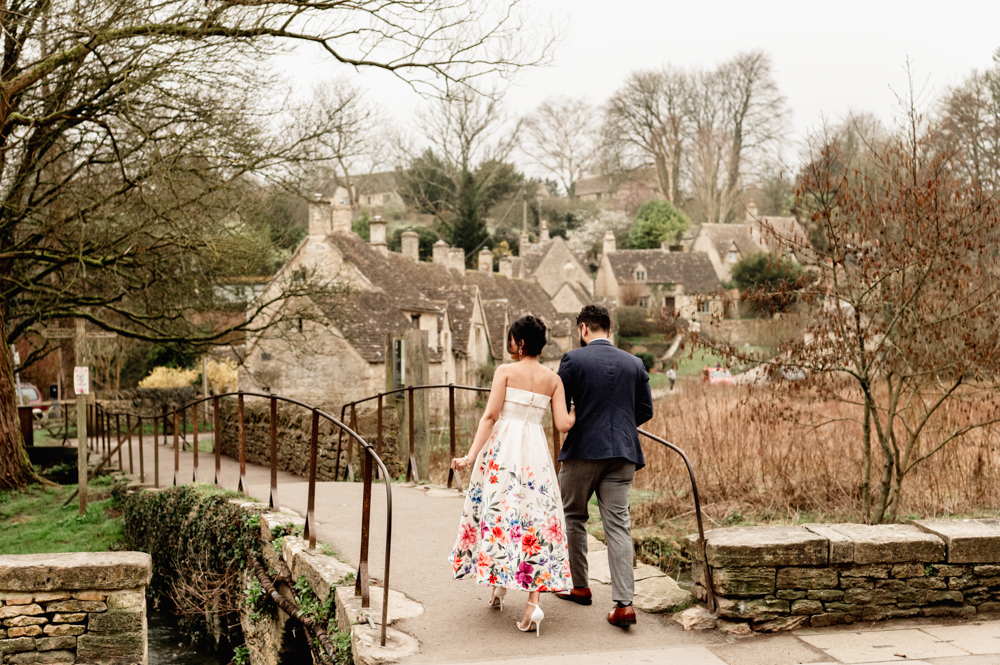 couple on a bridge bibury