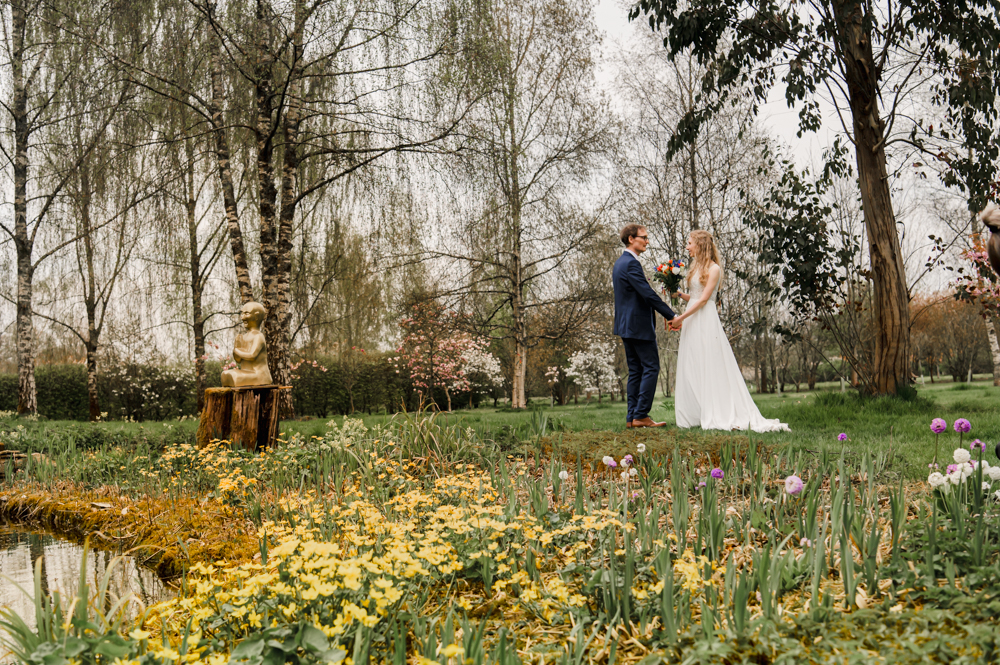 bride in a colourful garden matara centre cotswolds