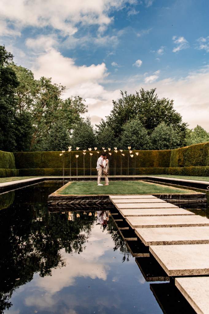 couple getting engaged blue skies