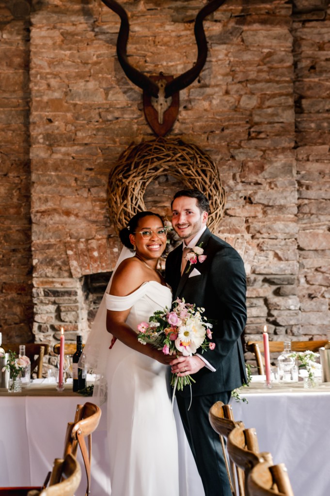 bride and groom in a barn wedding venue cotswolds