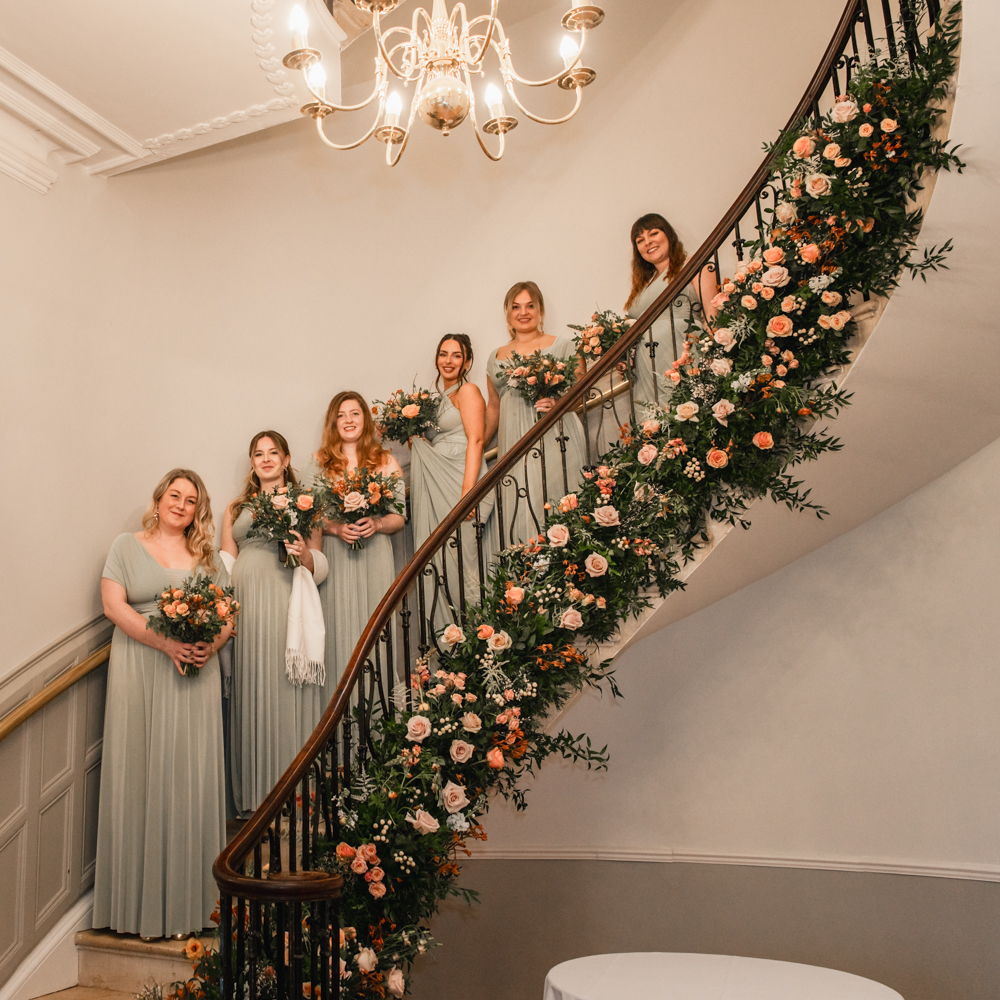 bridesmaids on staircase eastington park wedding