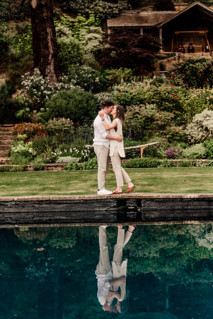 a couple kissing cotswold engagement