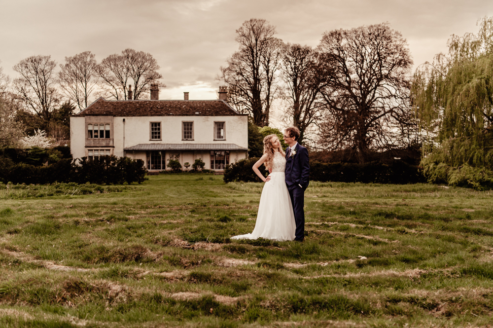 bride and groom in a dreamy garden  cotswolds