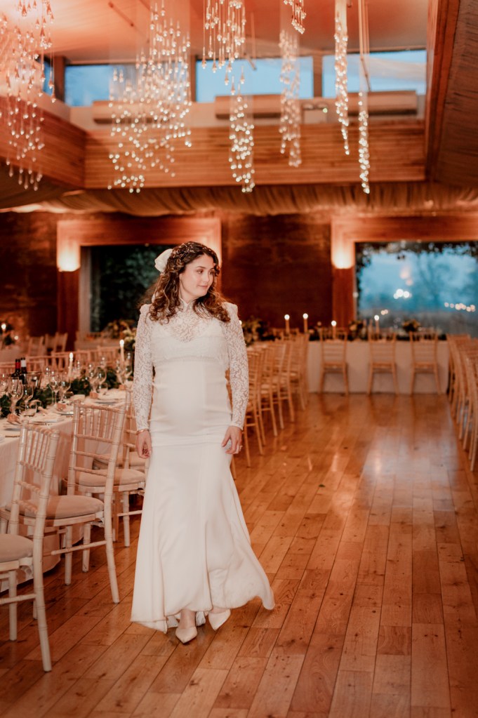 bride walking in Gillyflower winter wedding elmore court