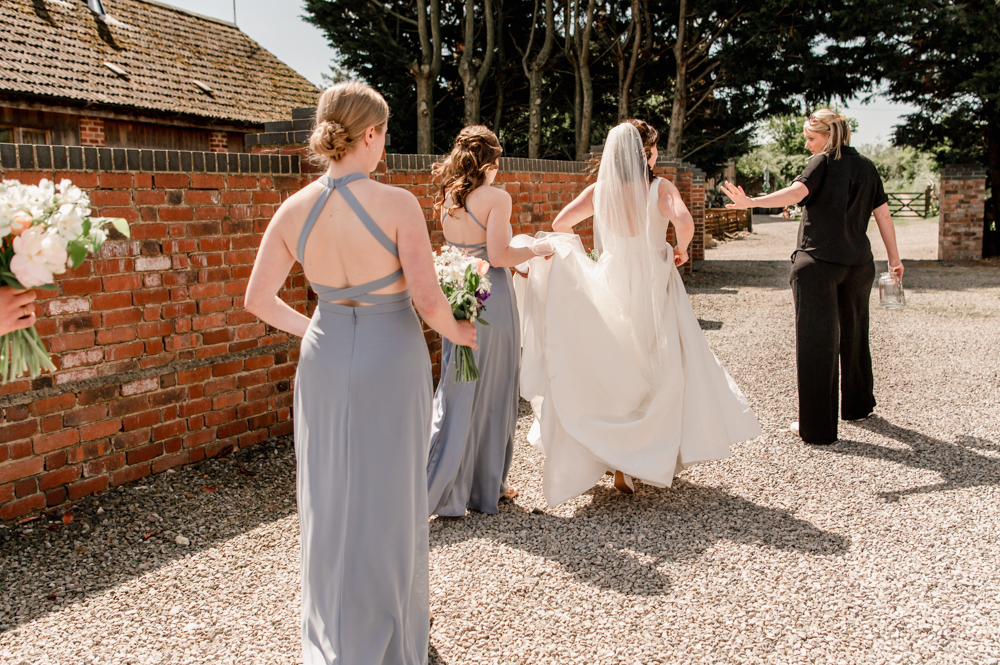 bride walking to ceremony  natural wedding photography cotswolds