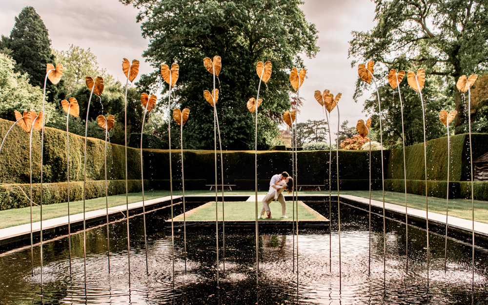 a couple kissing surprise  proposal cotswolds