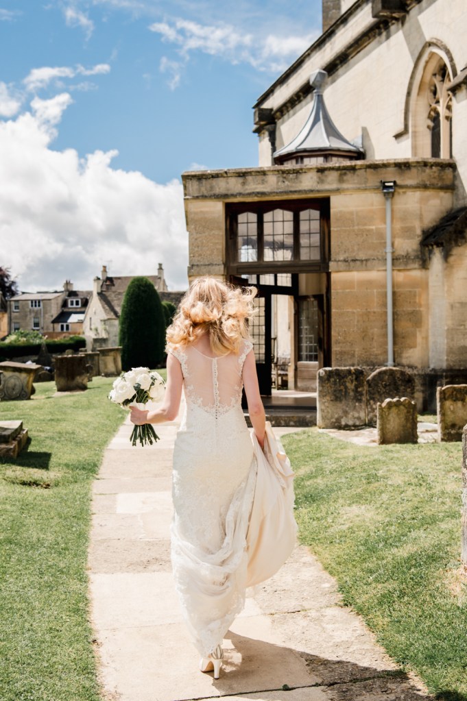 bride walking st mary's church painwick