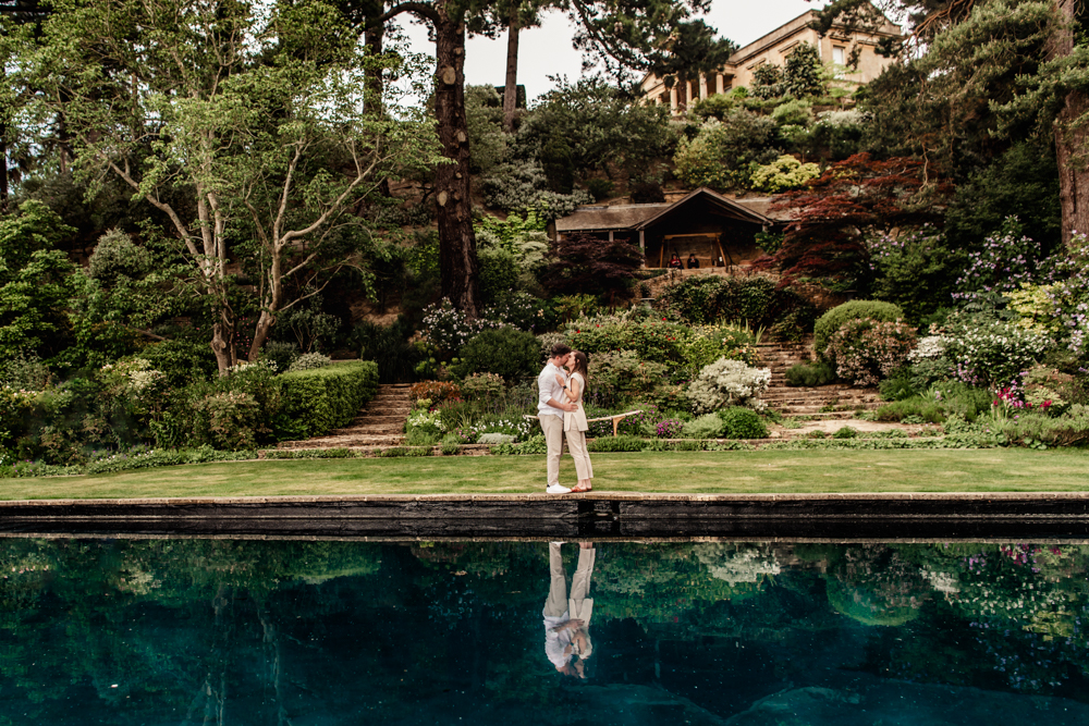 a couple kissing cotswold engagement