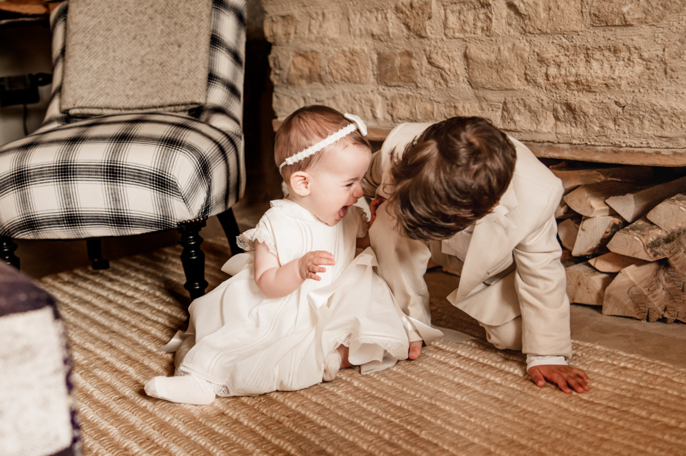 baby and toddler playing