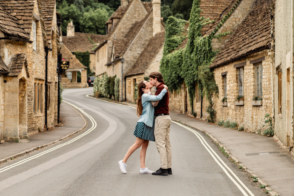couple kissing english village