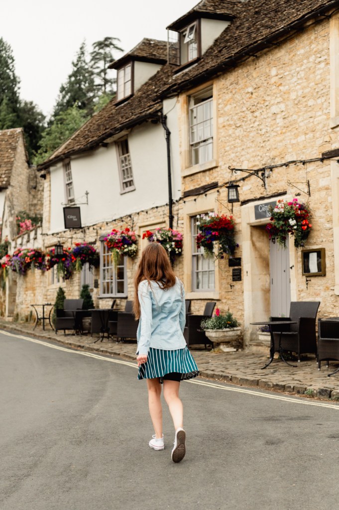woman walking in a cotswold village
