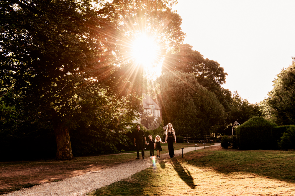 family walking at sunset cotswold calcot spa 