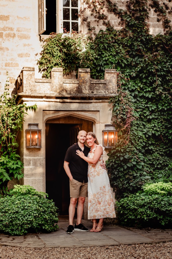 couple in front of a castle looking hotel cotswolds