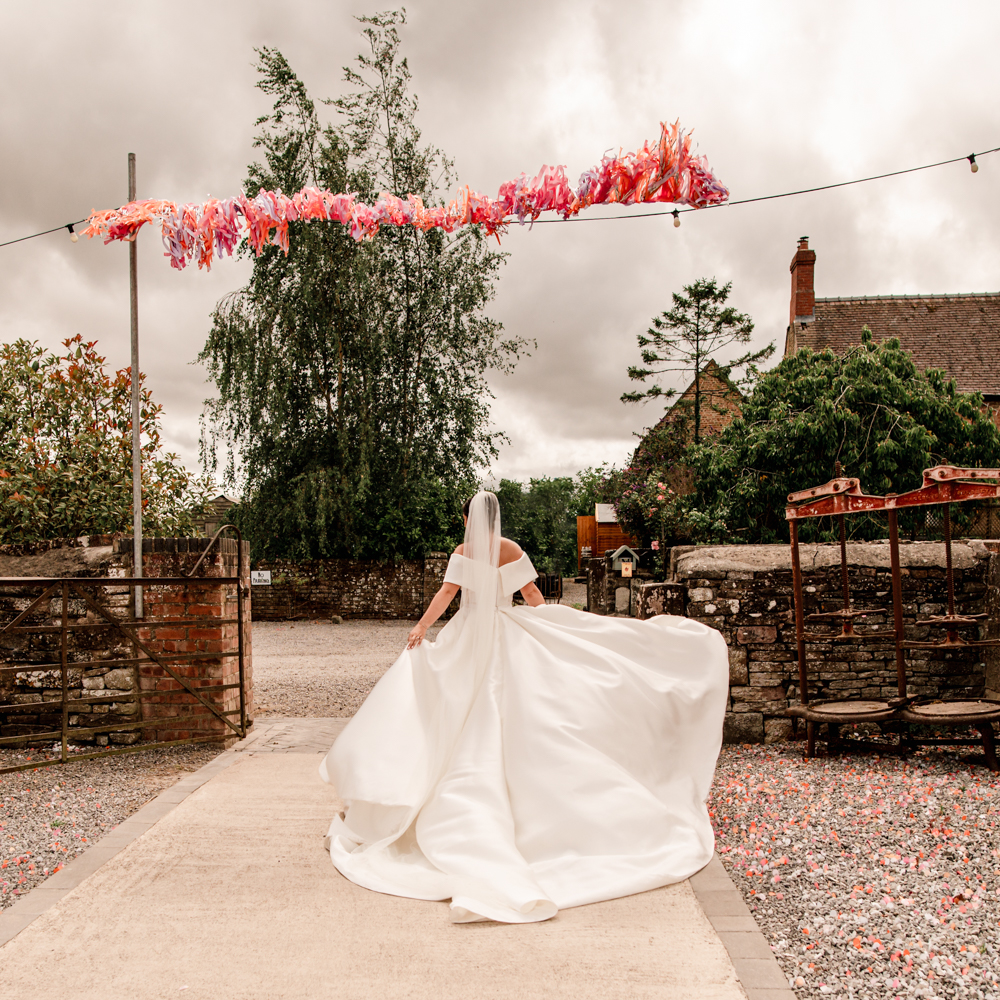 bride walking in a big dress editorial wedding