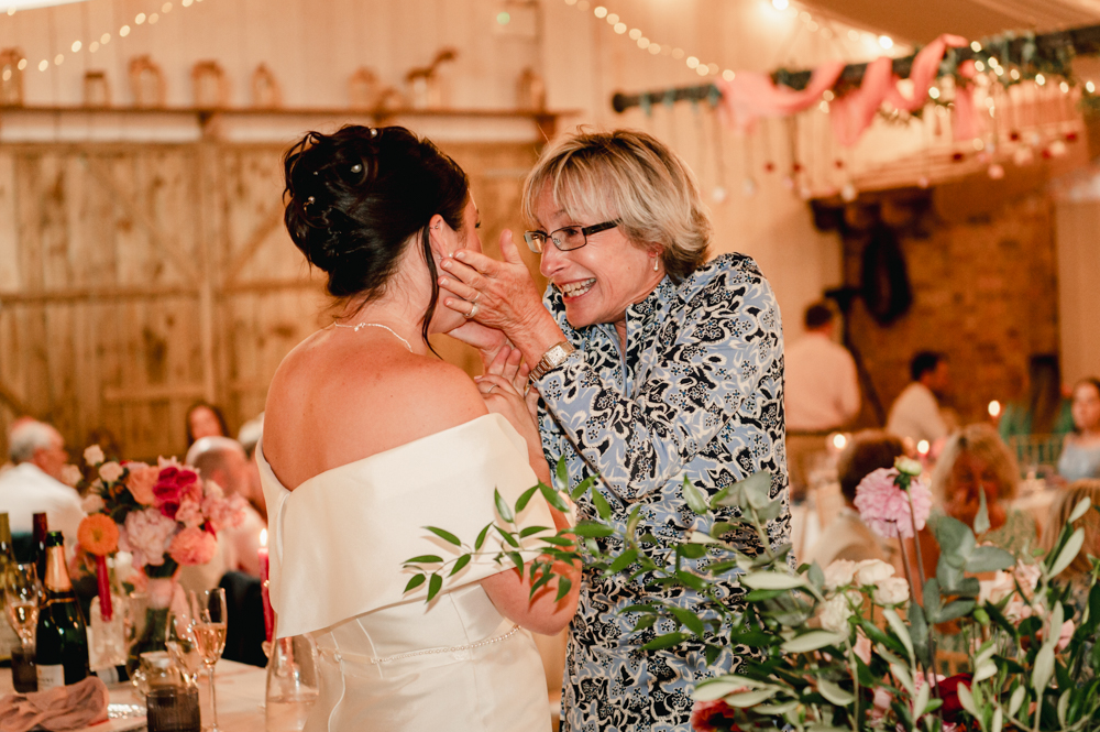 documentary wedding photos bride hugging mum