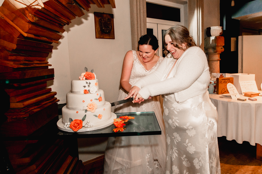 brides cutting cake old lodge wedding