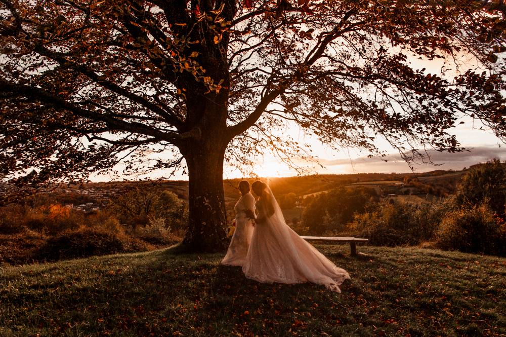 couple walking dramatic wedding photography cotswolds 
