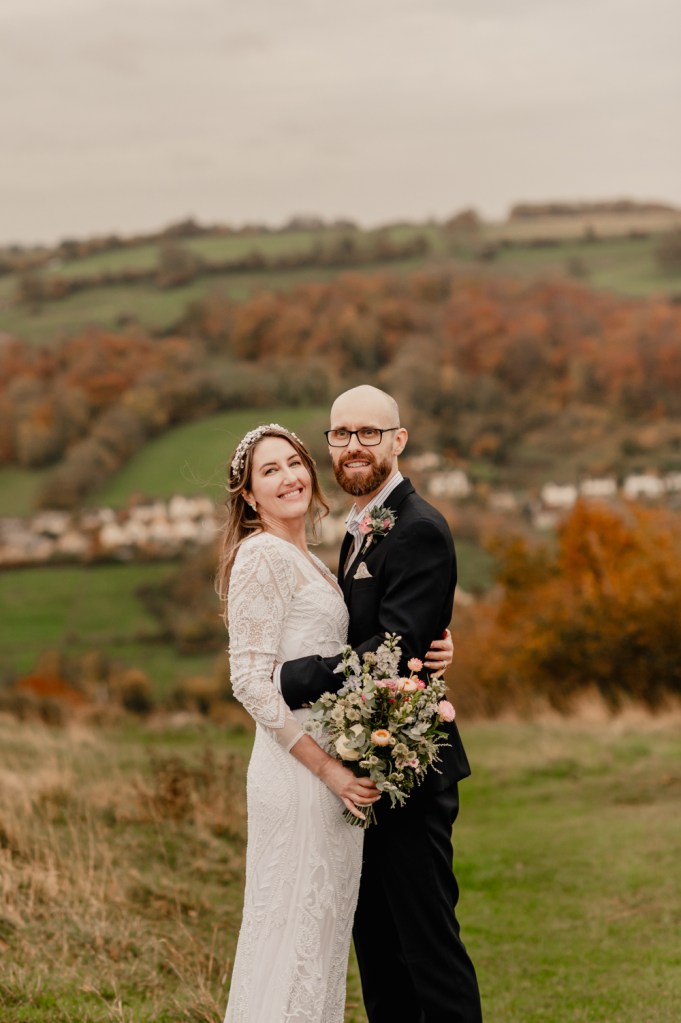 couple in front of the countryside views wedding