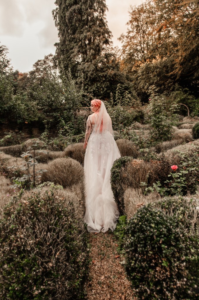 bride walking in a dreamy garden 