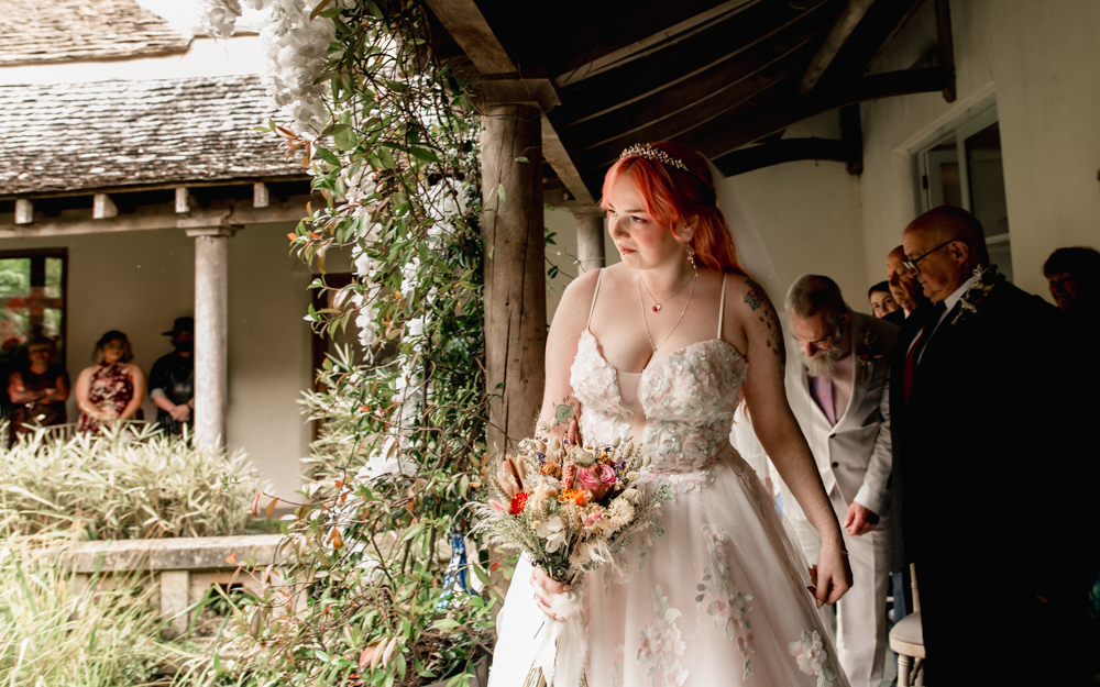 bride walking down the aisle at Matara centre