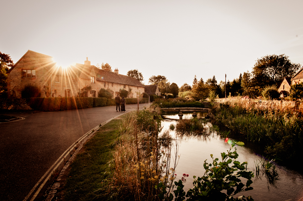 dramatic engagement in a cotswold village with bridge  