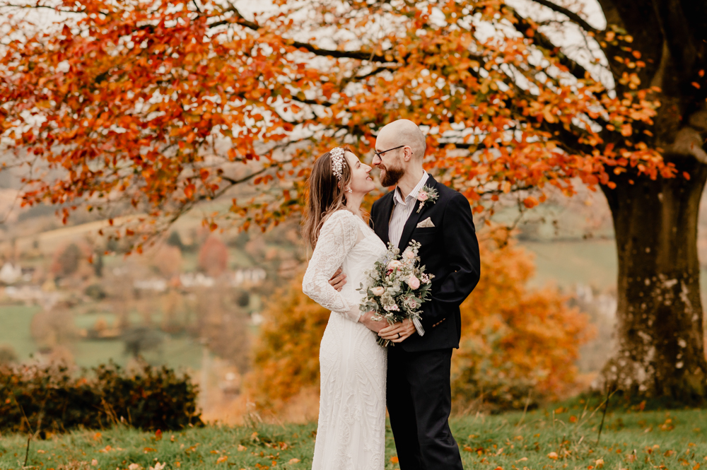 bride and groom vibrant autumn backdrop