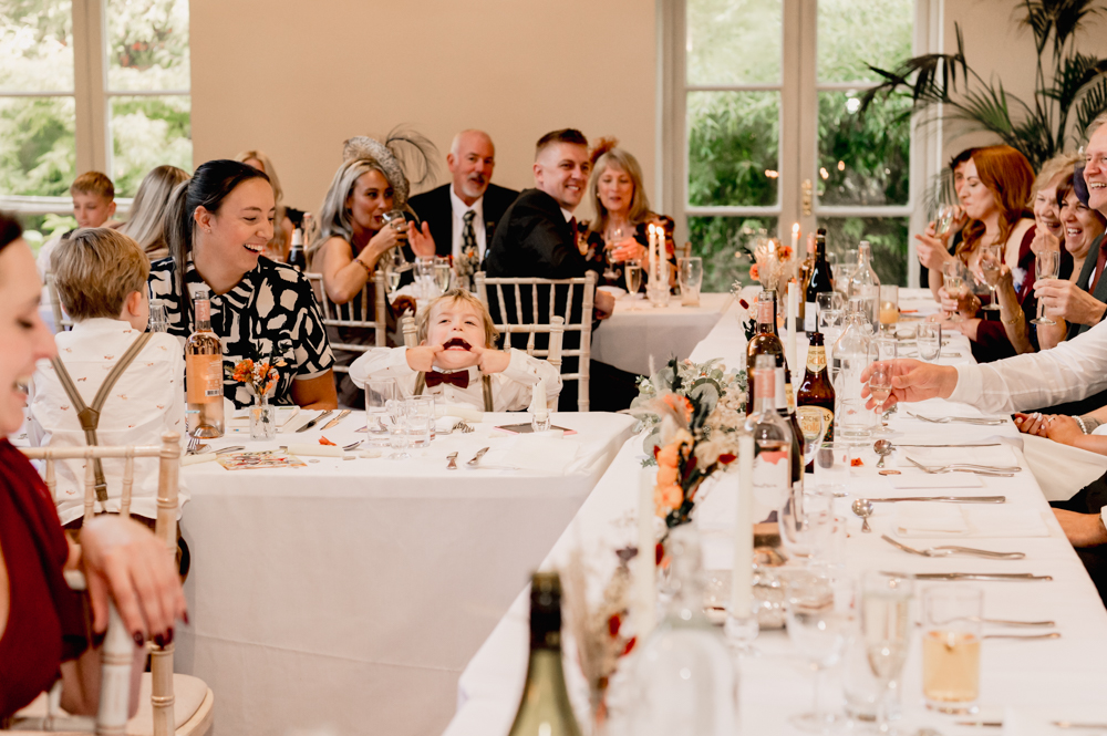 fun wedding photography child pulling face