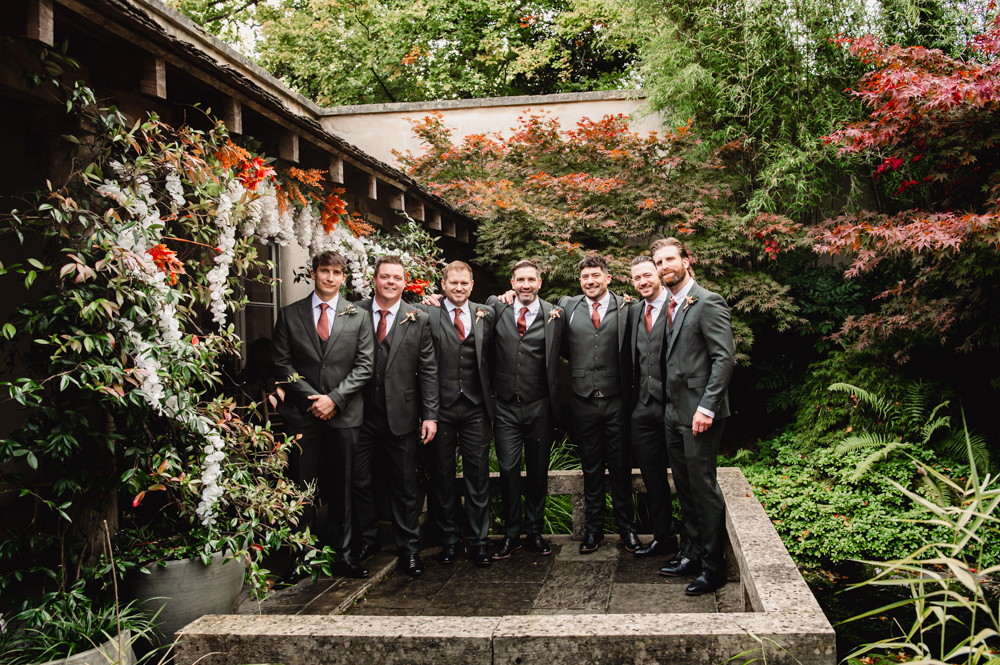 groom and groomsmen in cloistered courtyard matara