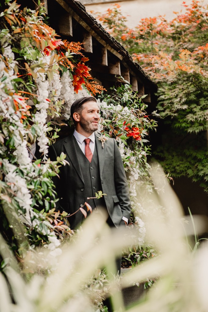 bride in a floral arch matara centre wedding