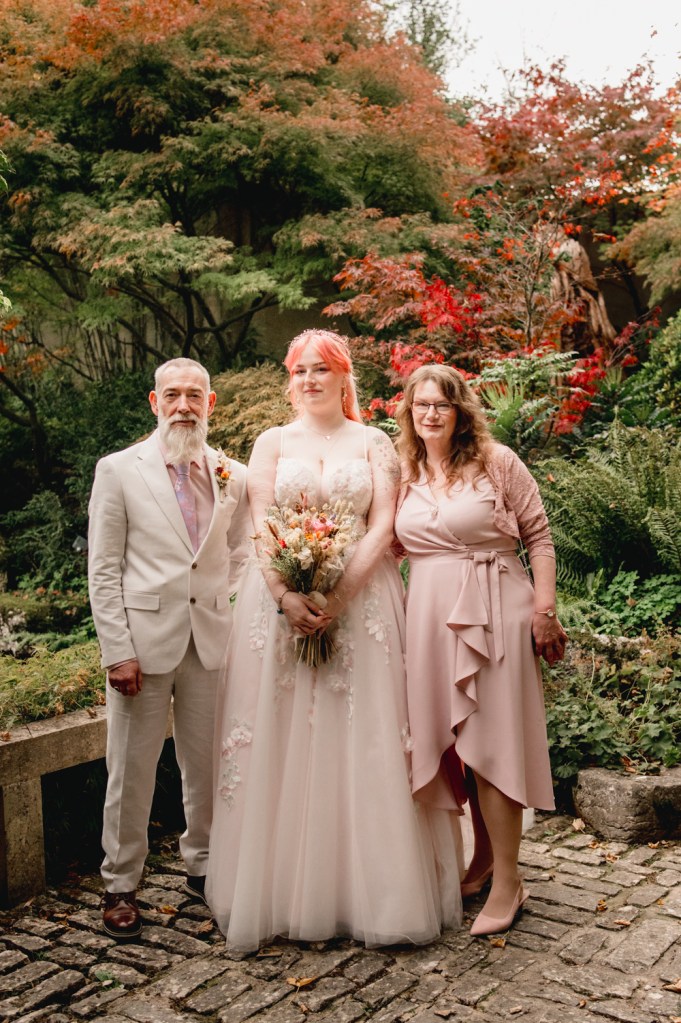 bride with mum and dad colourful wedding