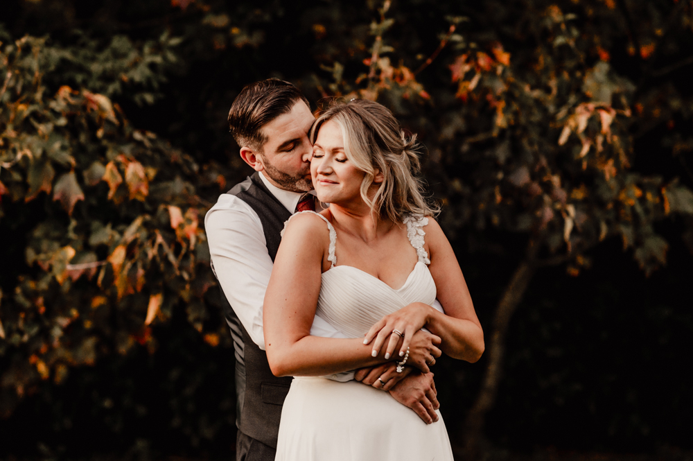 dramatic autumn portrait bride groom