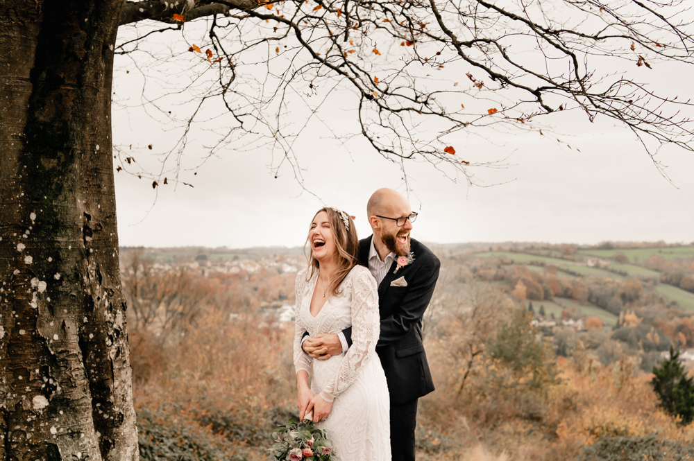 relaxed couple laughing in the countryside in the Cotswolds