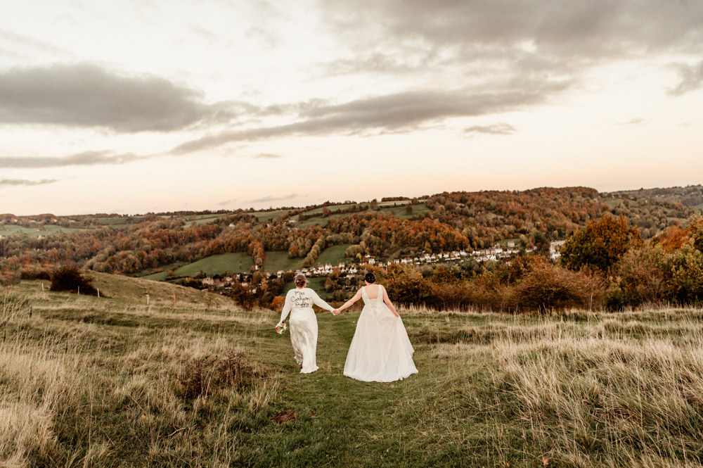 two brides walking in the countryside cotswolds
