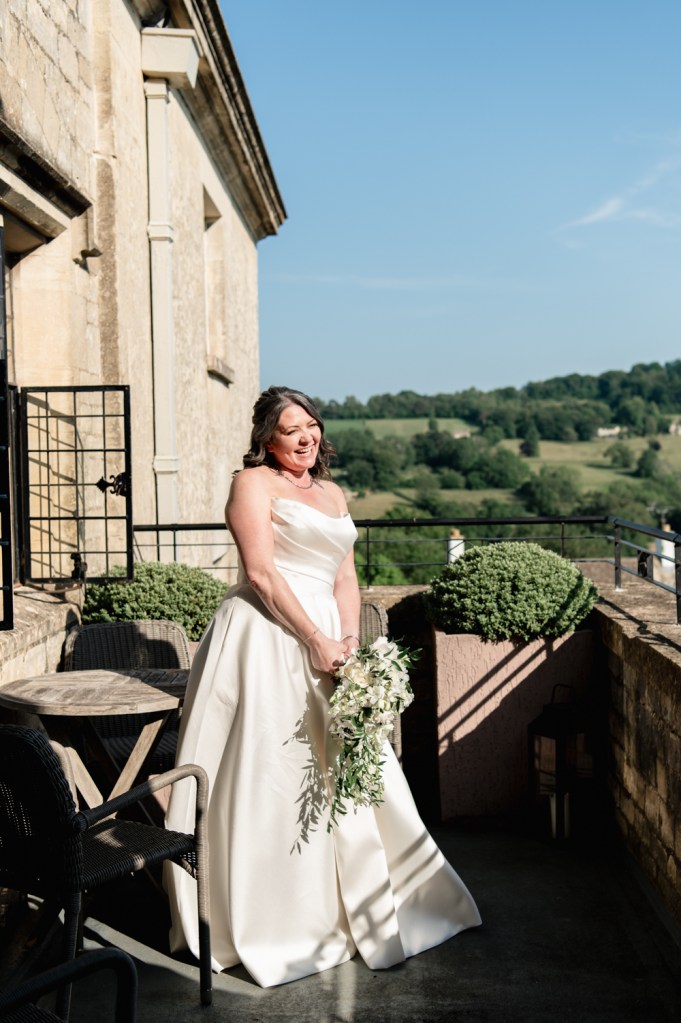 bride on a balcony with countryside views